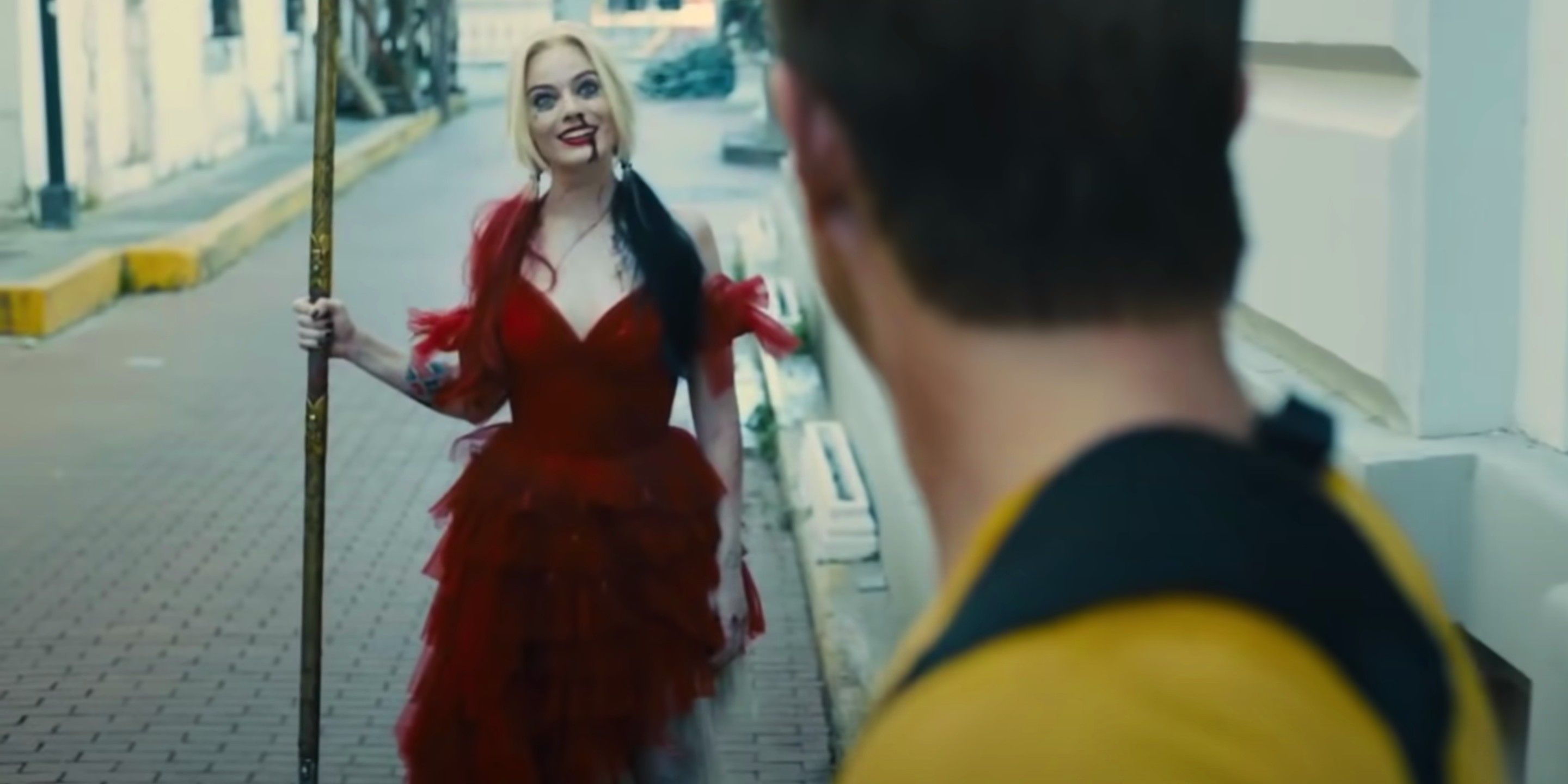 Harley Quinn reuniting with Rick Flag holding the javelin in James Gunn's The Suicide Squad