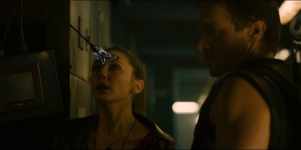 Hawkeye Sticking A Electrical Arrow On Wanda Maximoff's Forehead From Age Of Ultron