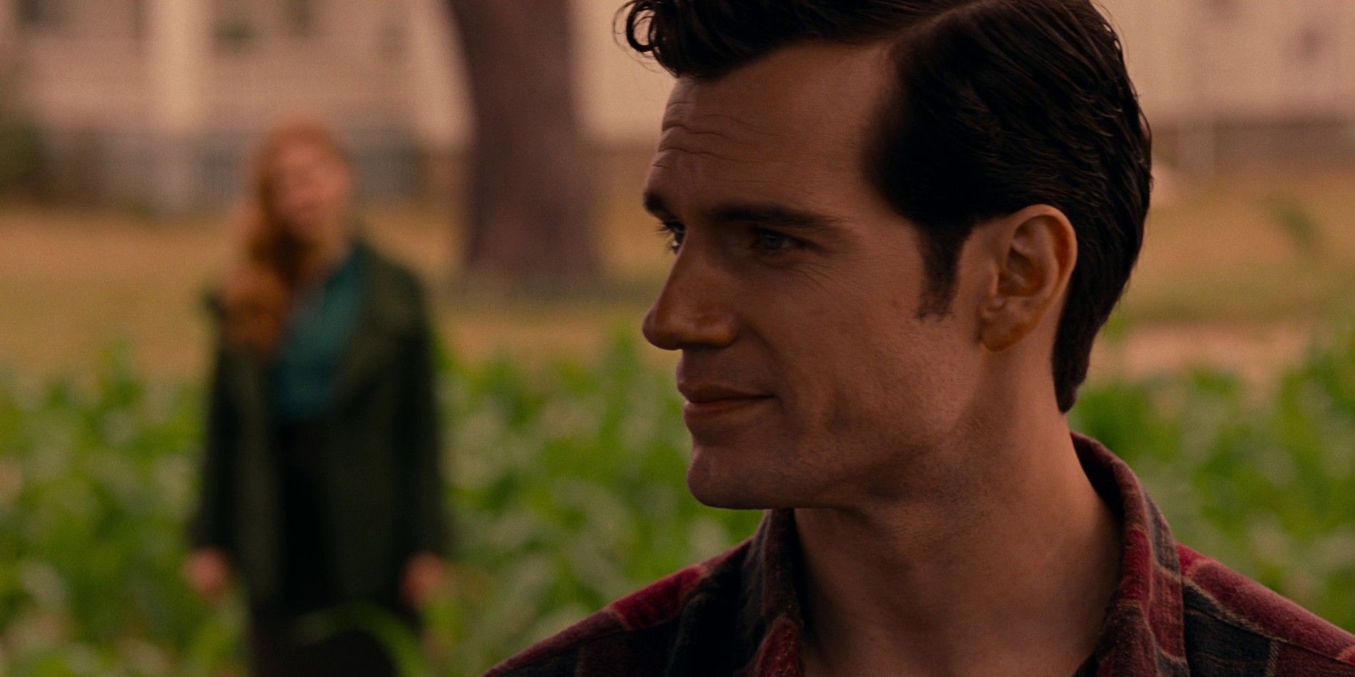 Clark Kent and Lois Lane talk in a field in Justice League