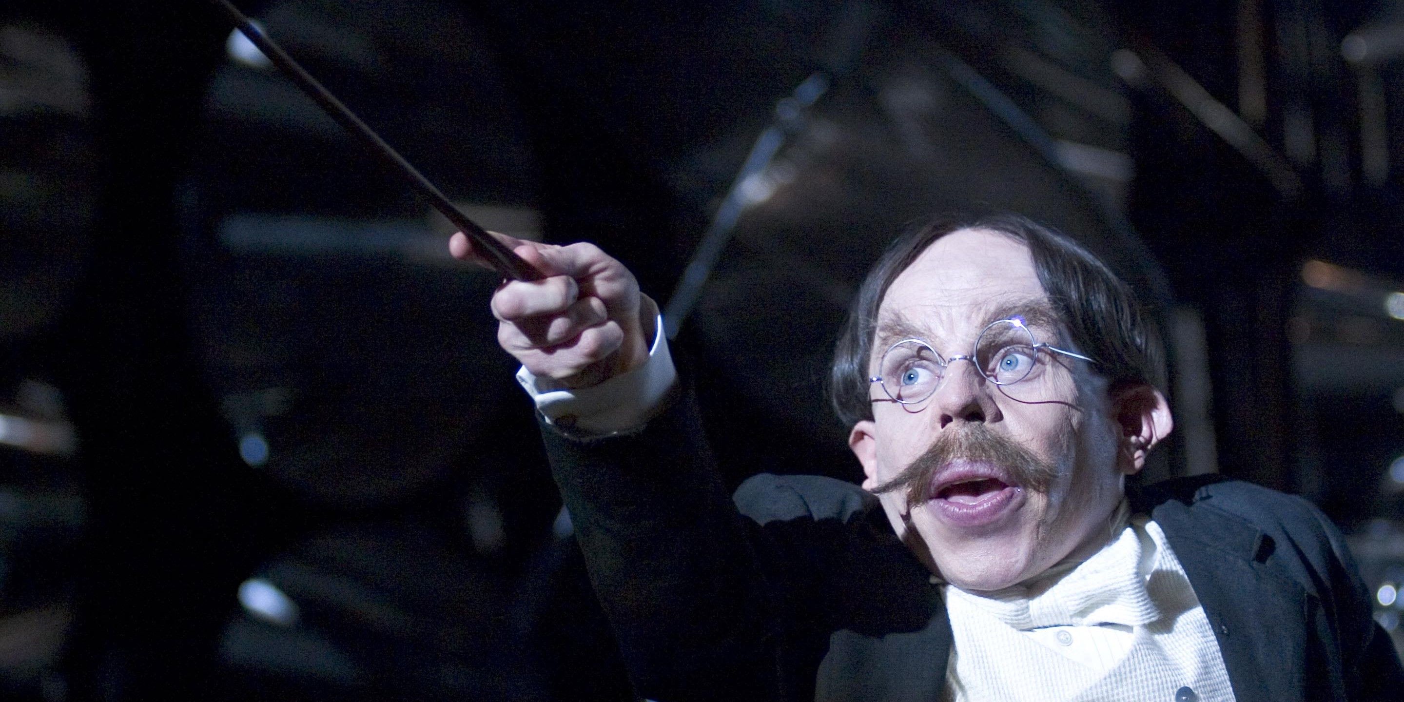 A wizard wielding a wand in Harry Potter.