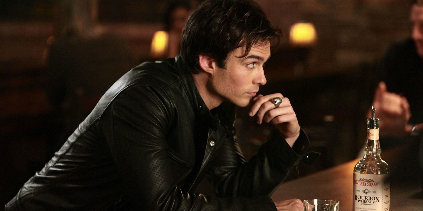 Damon at a bar looking to the distance in TVD