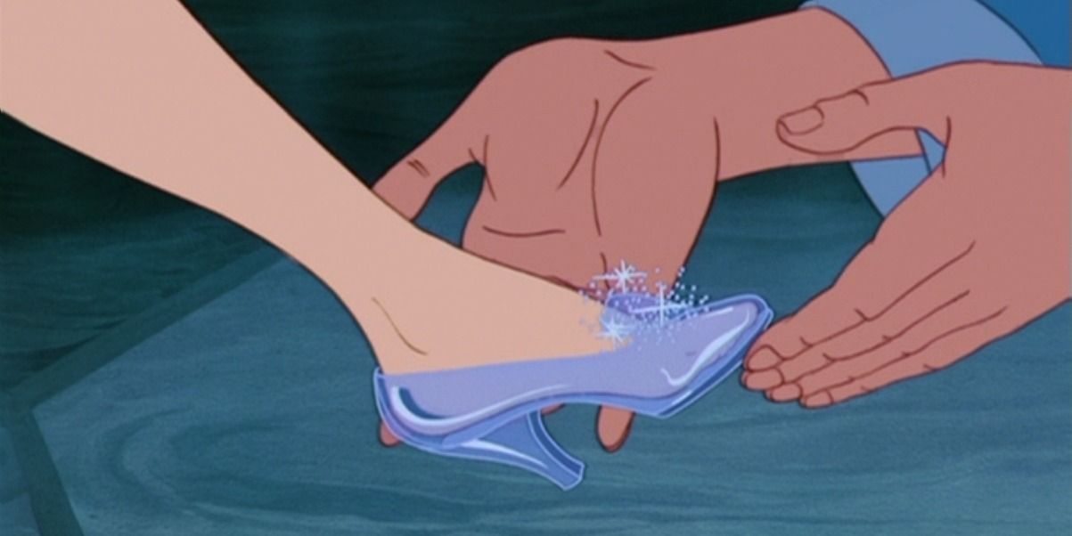 Cinderella putting on the glass slipper.