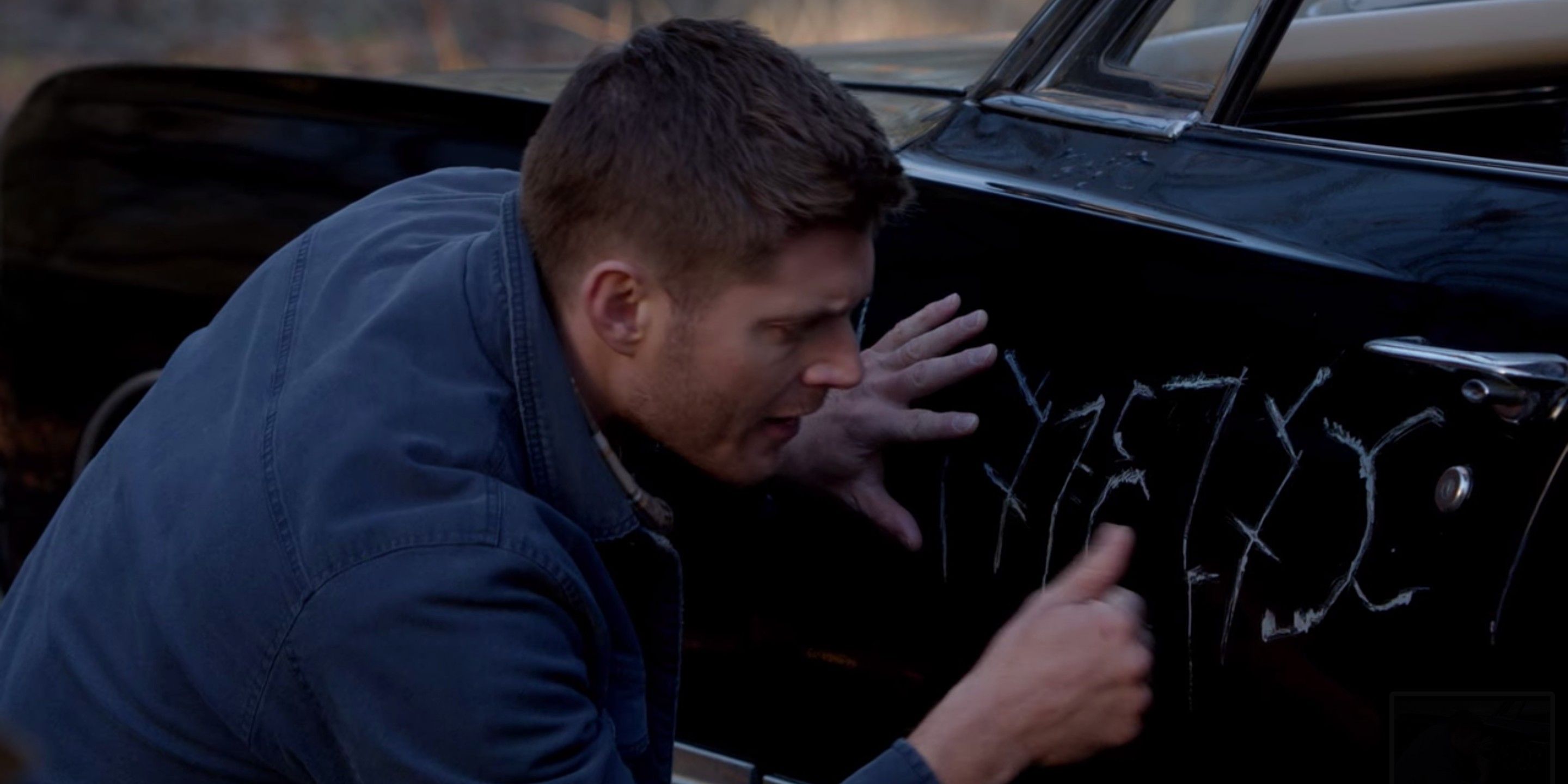 Dean cleans scratches on the Impala
