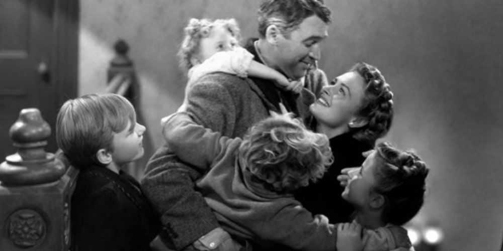 George is embraced by his family in It's a Wonderful Life