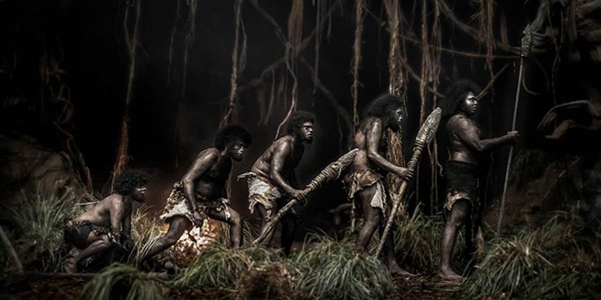 Men with spears in forest at night from Jallikattu
