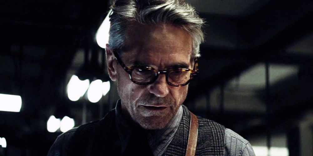 Alfred Pennyworth looking serious in the Batcave in Batman v Superman