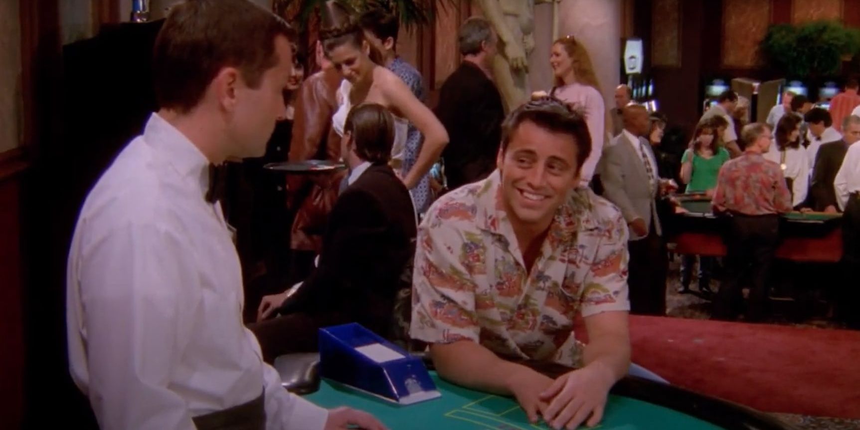 Joey talks to a croupier in a casino