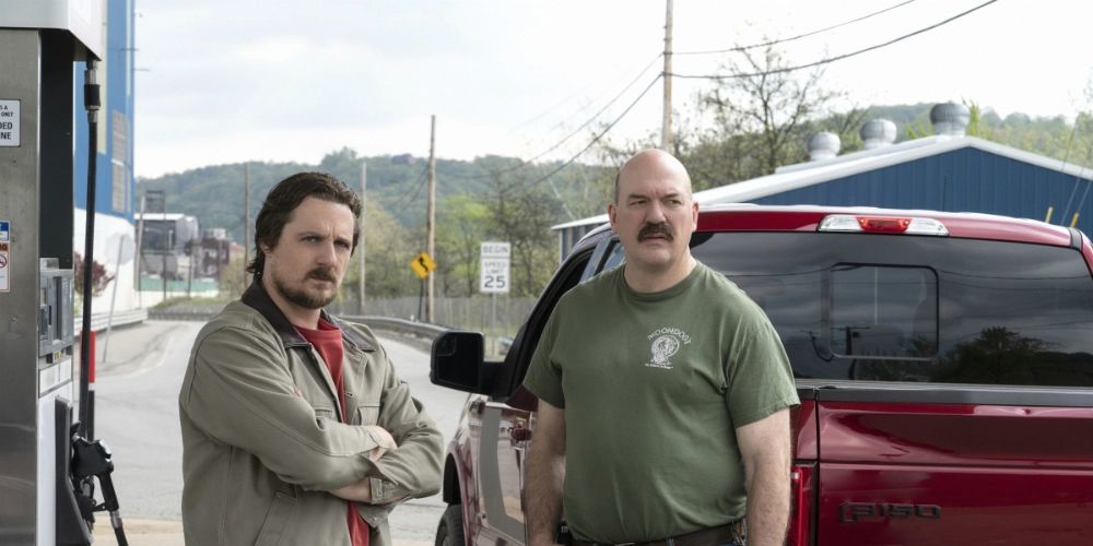 John Carroll Lynch and Sturgill Simpson standing at a gas station in One Dollar