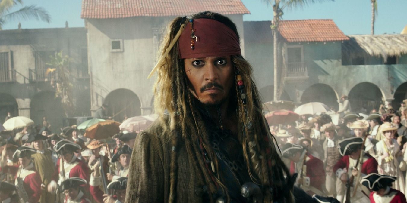 Johnny Depp in Pirates of the Caribbean as Jack Sparrow as chaos breaks out behind him