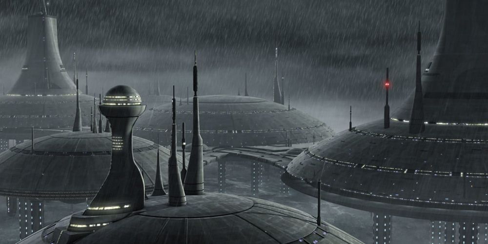 Un'immagine di Kamino in The Clone Wars.  L'immagine mostra diversi edifici colpiti dalla pioggia