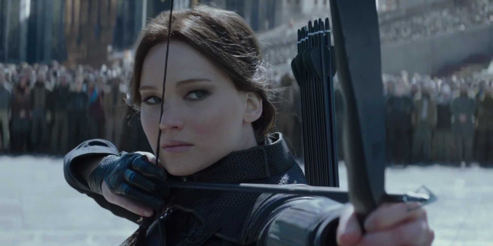 Katniss points her bow and arrow at President Snow in Hunger Games: Mockingjay