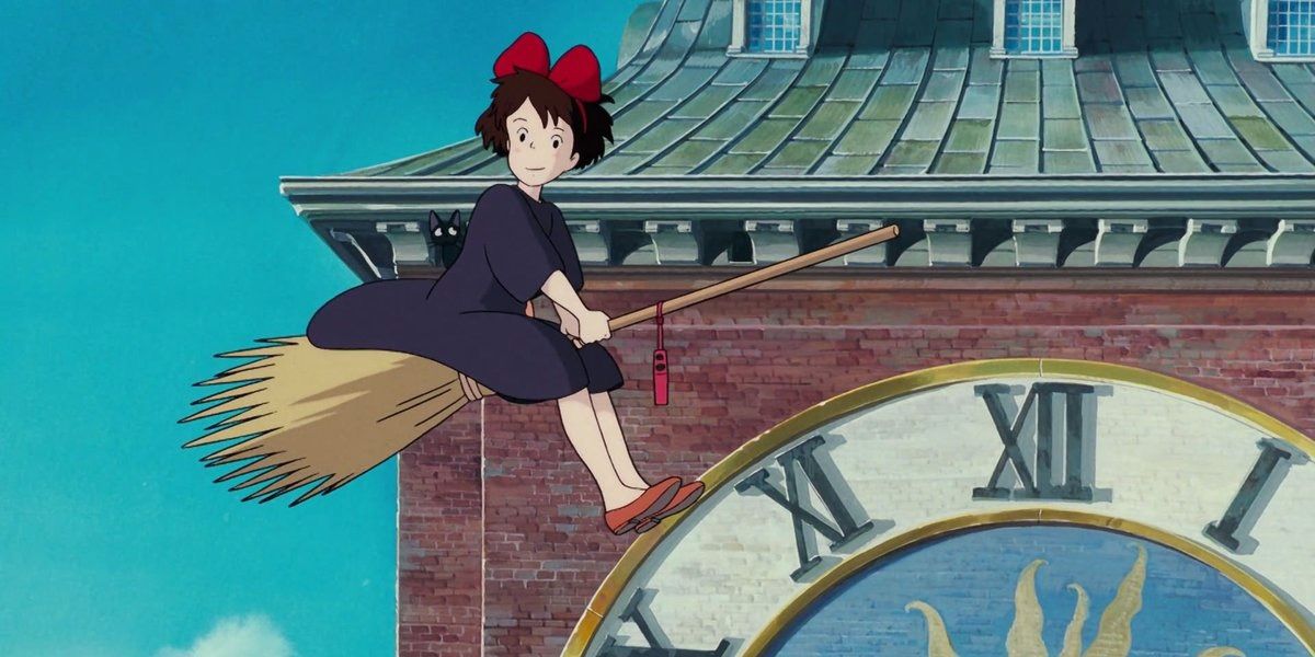 Kiki on a broom flying by clock tower in Kiki's Delivery Service