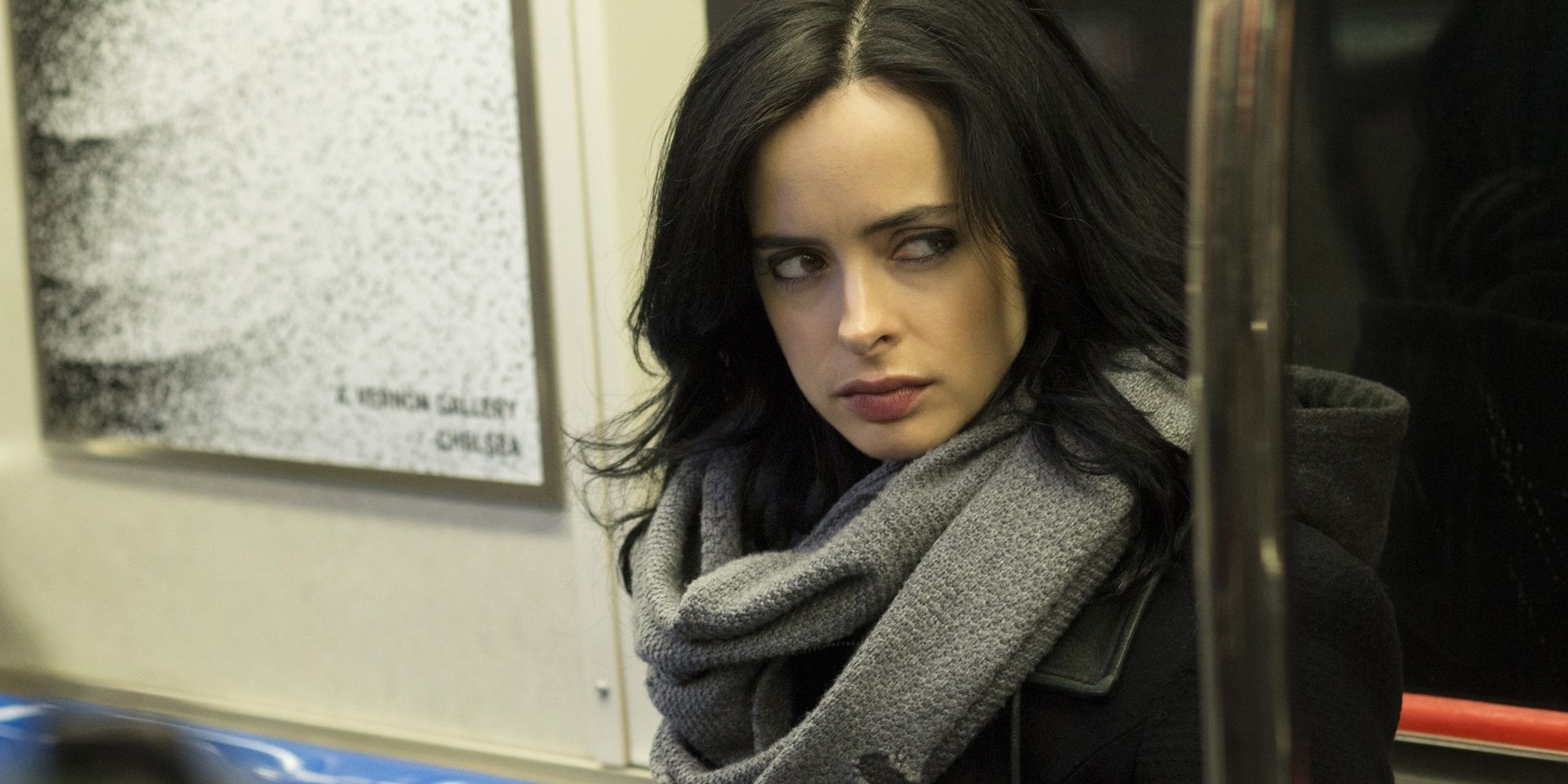 Jessica Jones riding the subway and looking suspiciously at something