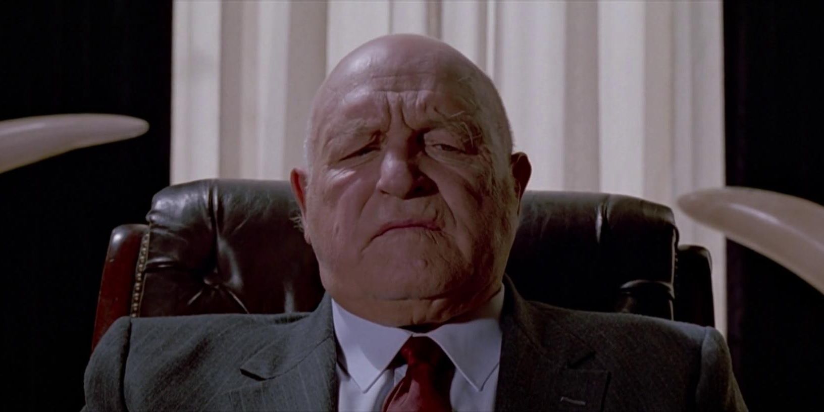 Lawrence Tierney as Joe Cabot in his office in Reservoir Dogs