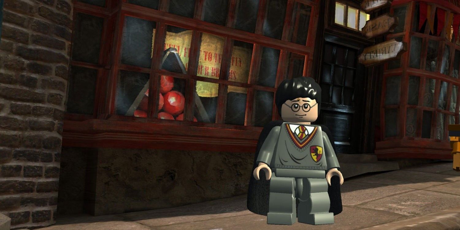 Scene of LEGO Harry Potter in Lego Harry Potter Collection game, LEGO Harry standing in front of a shop window