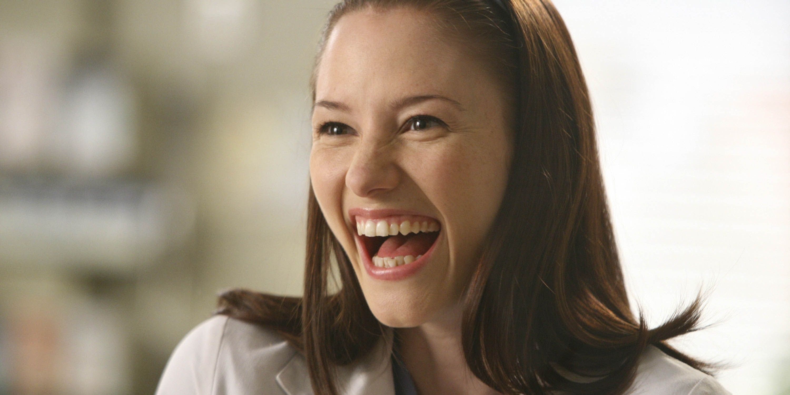 Lexie Grey smiling broadly in Grey's Anatomy