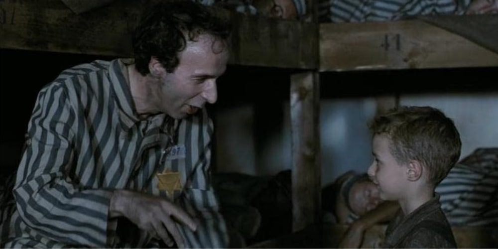 Scene in concentration camp with father in son in Life is Beautiful