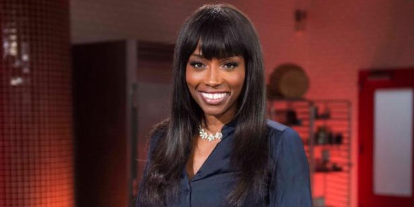 Lorraine Pascale Spring Baking Championship smiling in black blouse 