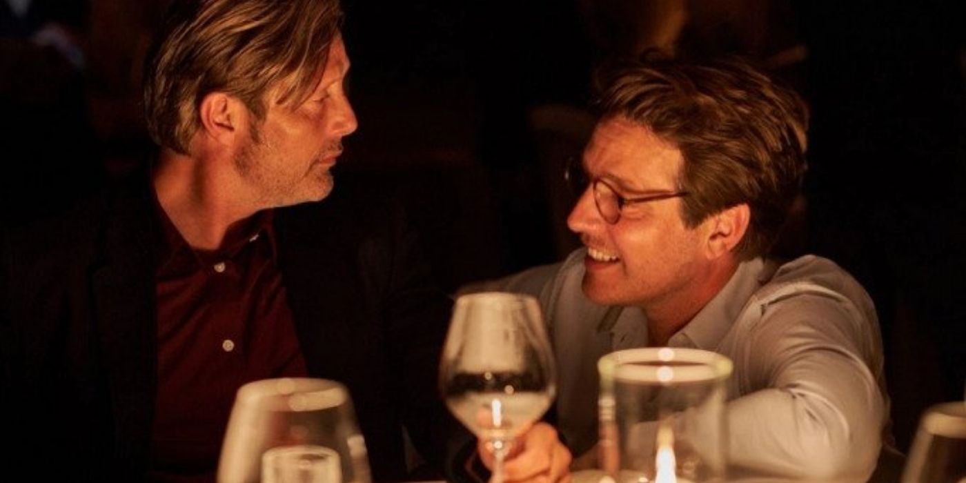 Mads Mikkelsen talking to Thomas Vinterberg in a behind-the-scenes shot from Another Round