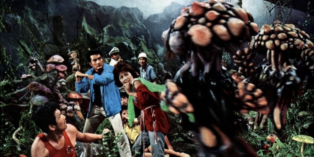 Shipwreck survivors being attacked by monster mushrooms in Matango