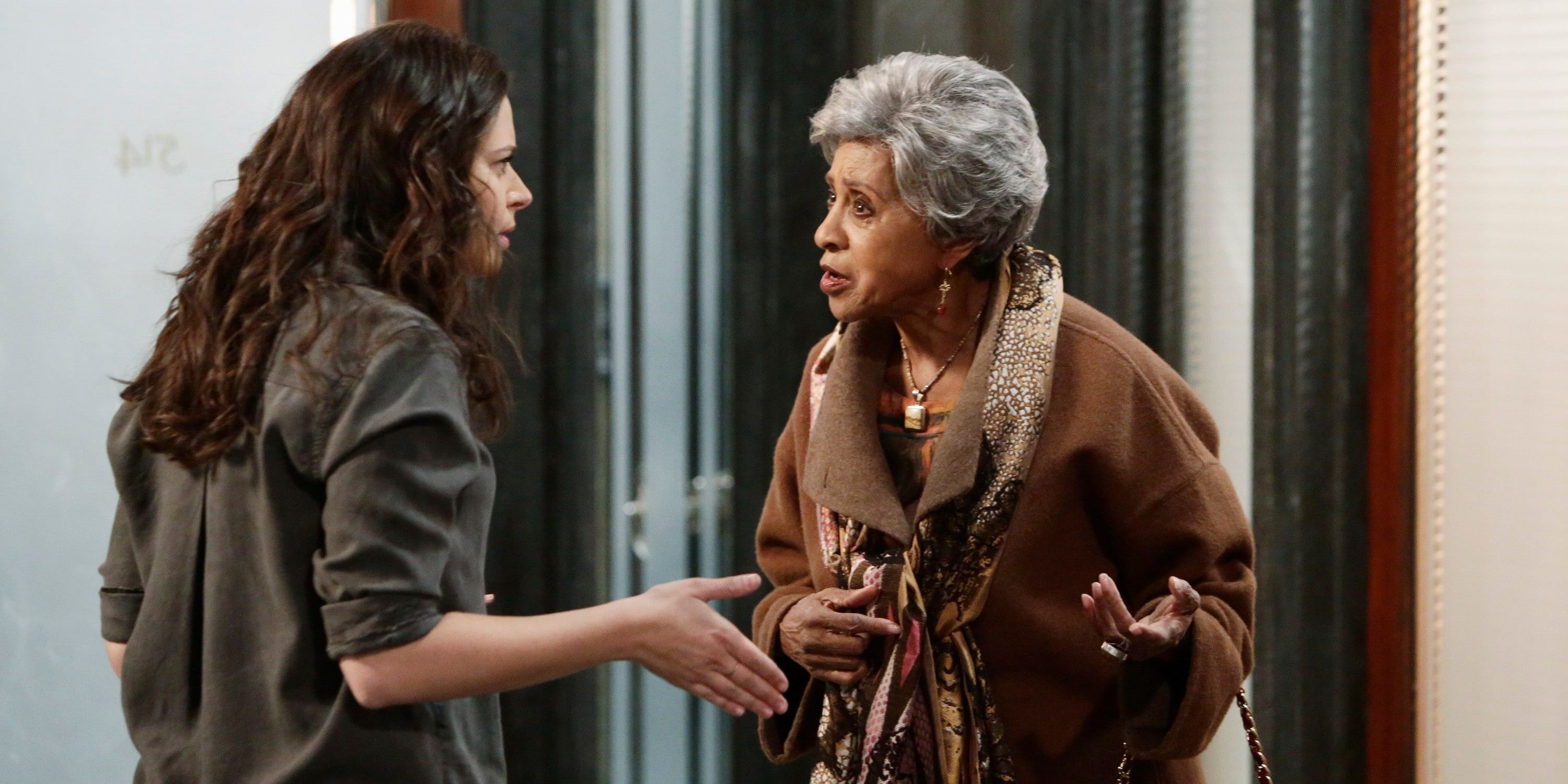 Marla Gibbs in Scandal standing outside door and talking