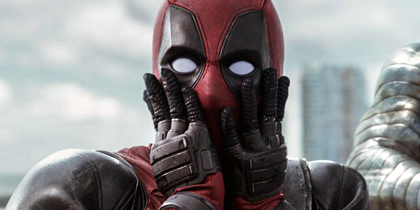 Ryan Reynolds as Deadpool looking shocked with his hands in his mouth in Deadpool (2016)