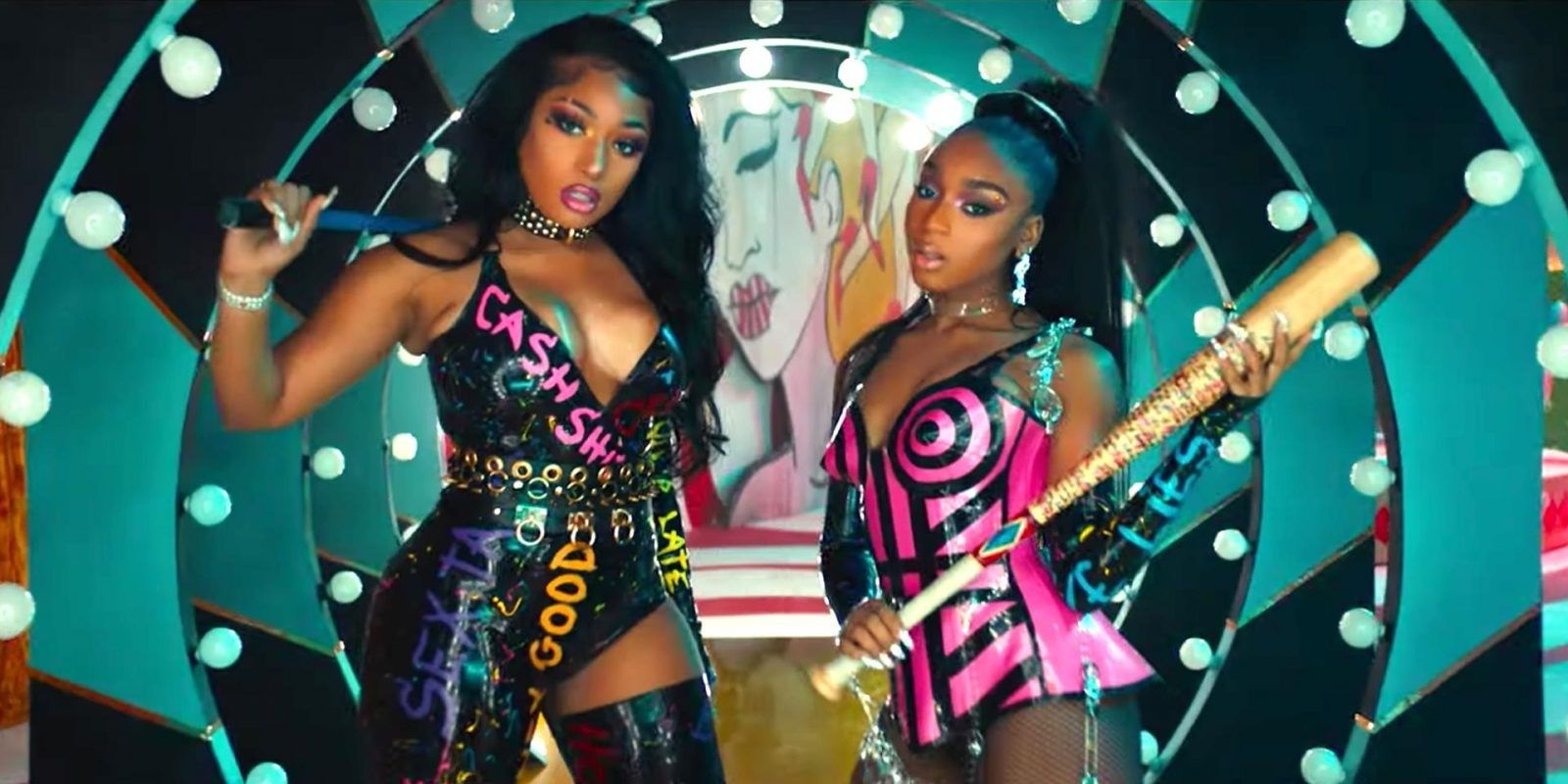Megan Thee Stallion and Normani holding baseball bats in the video for Diamonds (Birds of Prey)