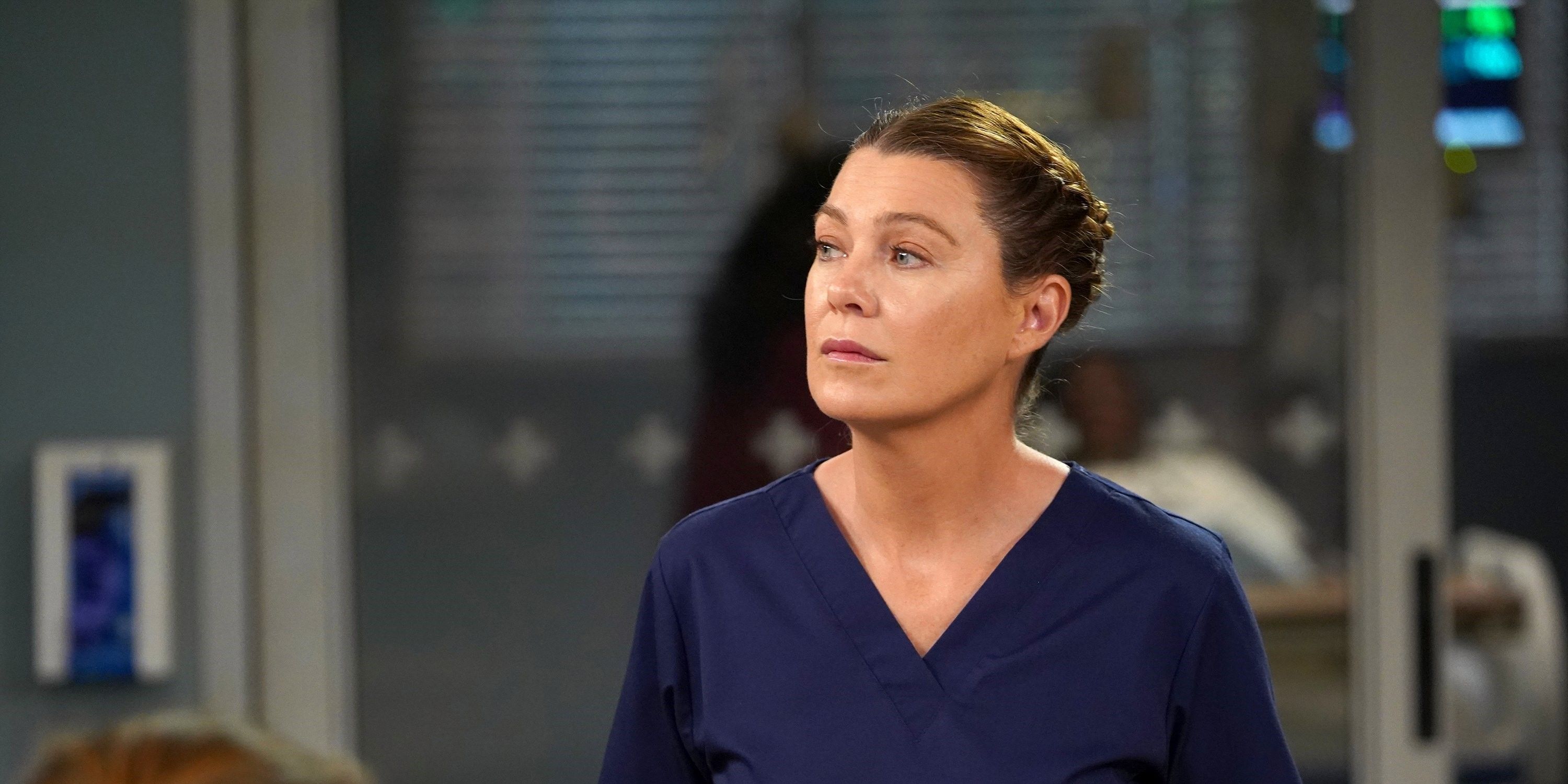 An image of Meredith Grey in her dark blue scrubs