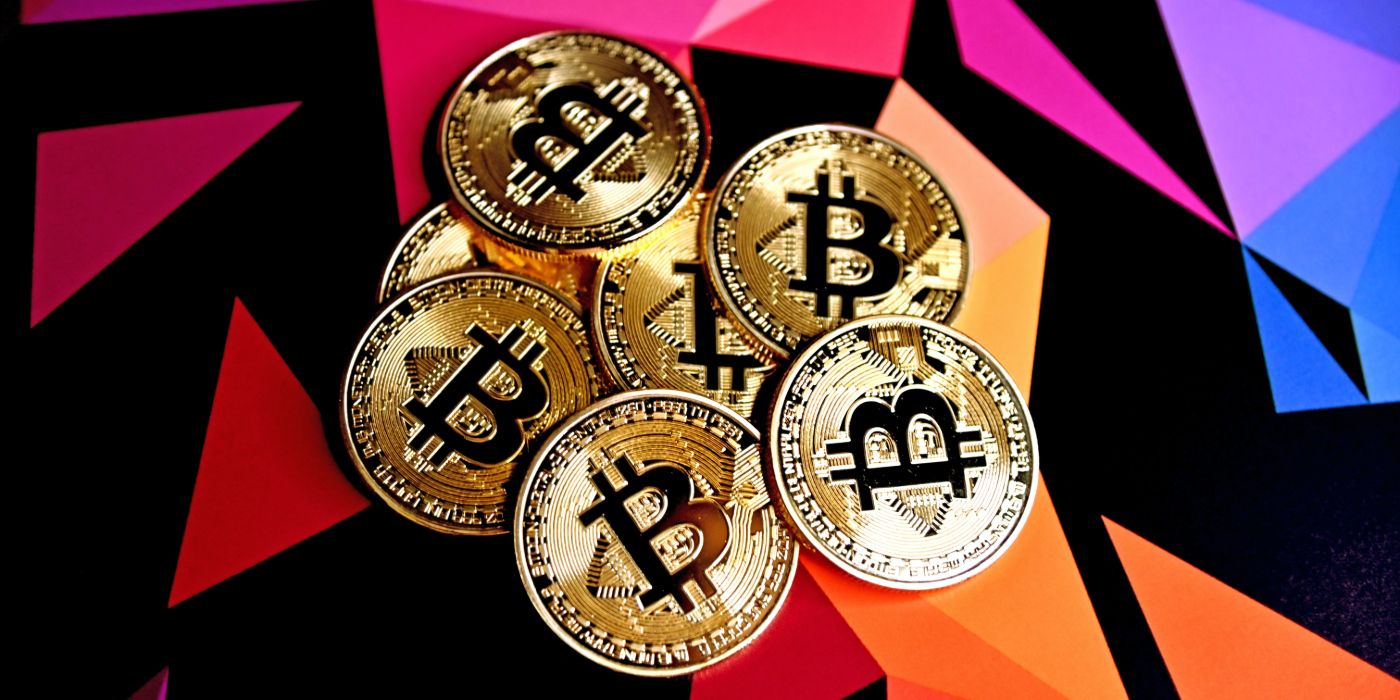 Bitcoins set against a colored background
