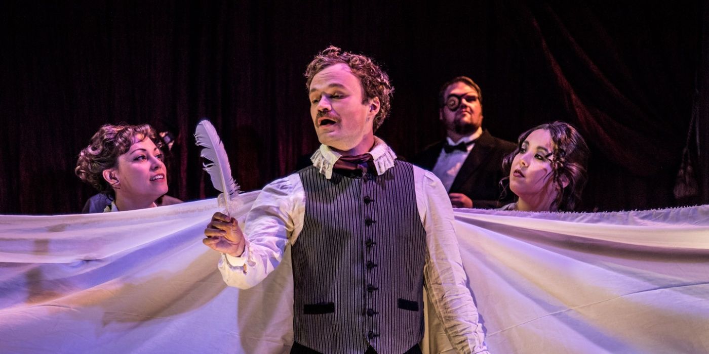 Edgar Allen Poe holds a quill in Nevermore musical