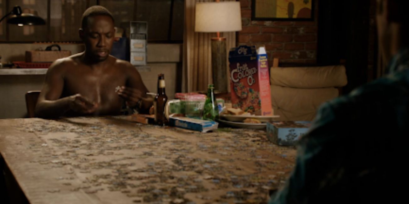Winston attempts to do a puzzle shirtless and with an assortment of snacks