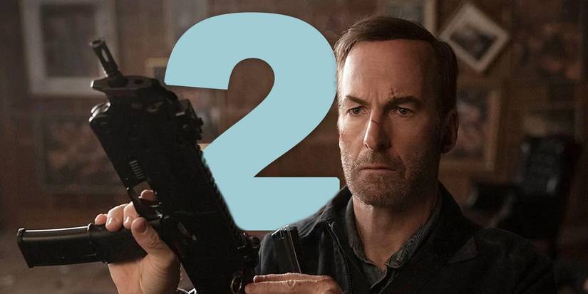 Hutch holds up a machine gun while looking serious with a big blue number 2 behind him from Nobody