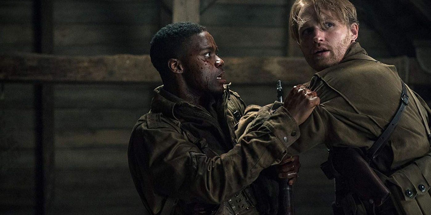 ovan Adepo grabbing Wyatt Russell by the shoulders in Overlord.
