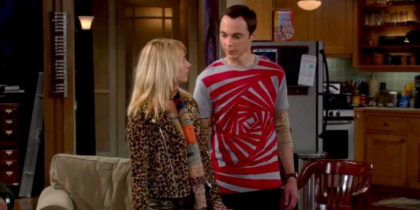 An image of Sheldon and Penny standing in his apartment. Penny is seen to be wearing a leopard print outfit