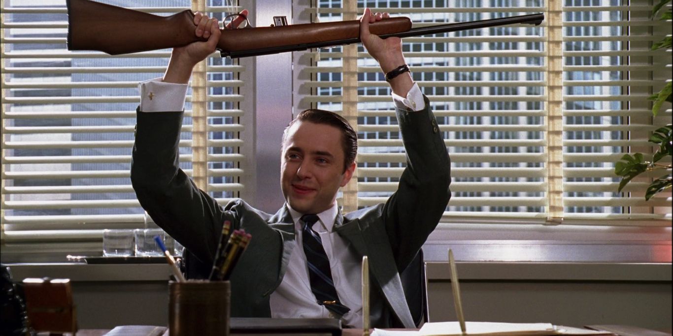 Pete Campbell with a rifle on Mad Men