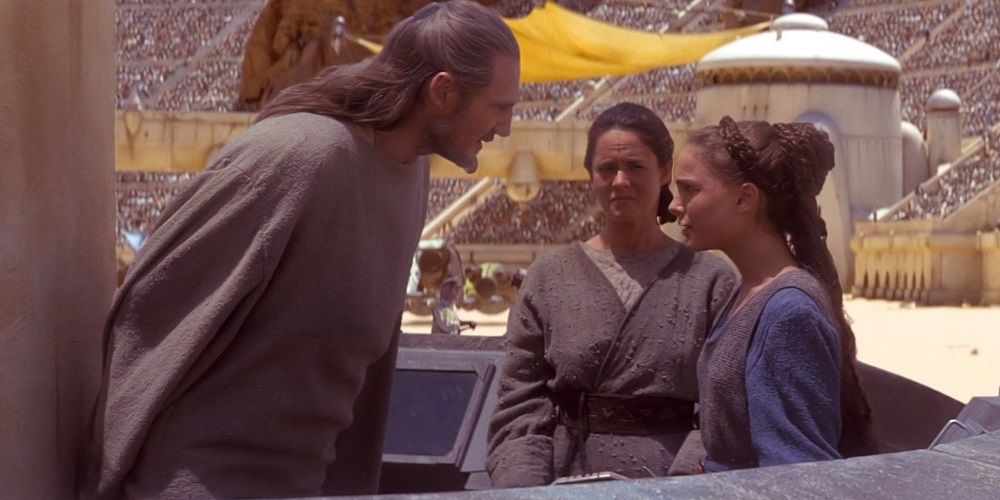 Qui-Gon, Shmi, and Padme at the pod race in The Phantom Menace
