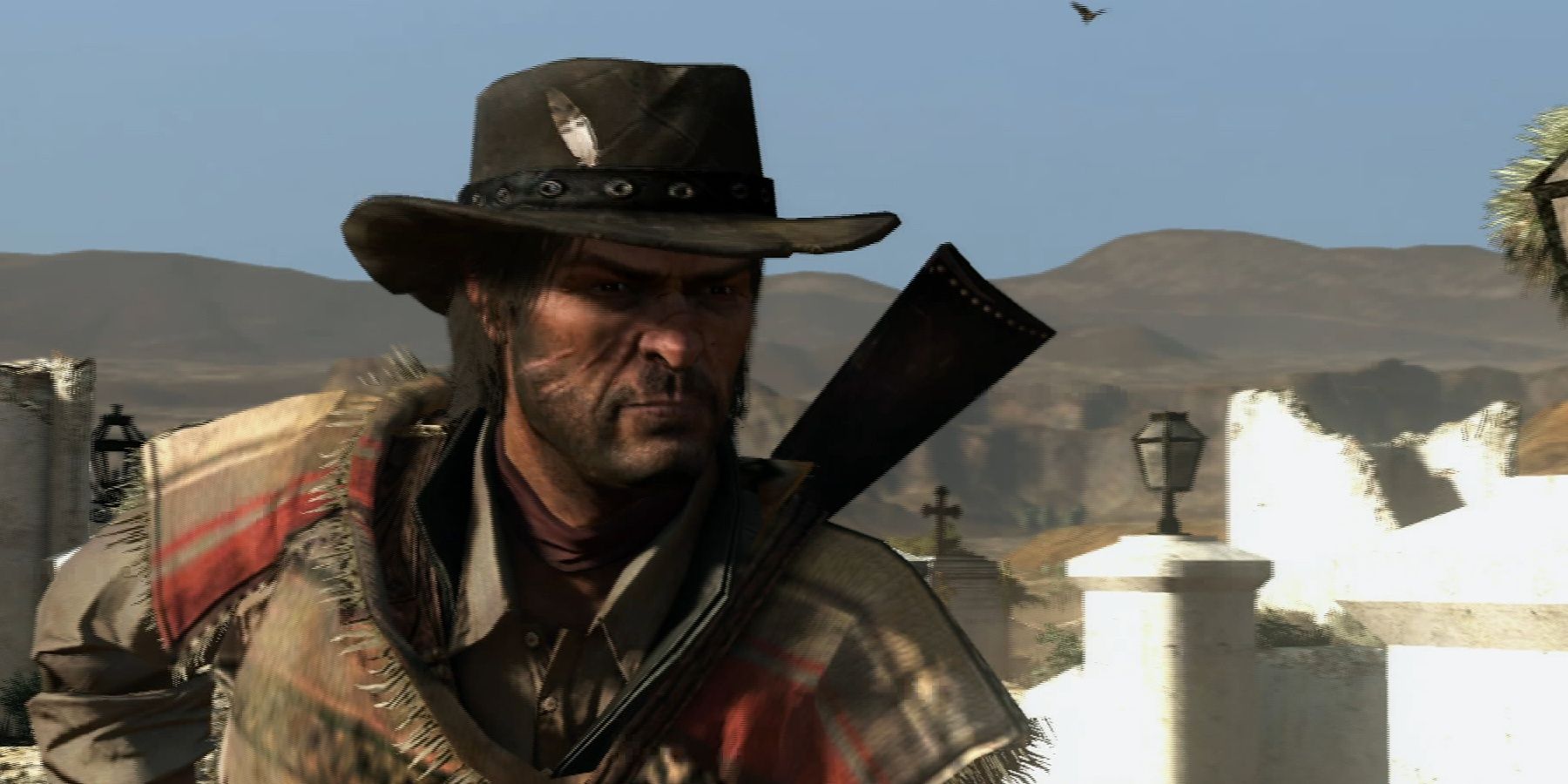 John Marston dressed in a poncho in Red Dead Redemption
