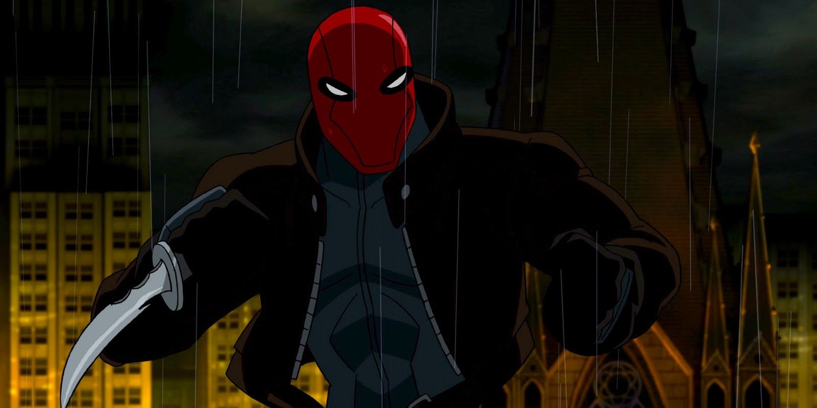 Red Hood wielding a knife in the rain in Batman: Under The Red Hood