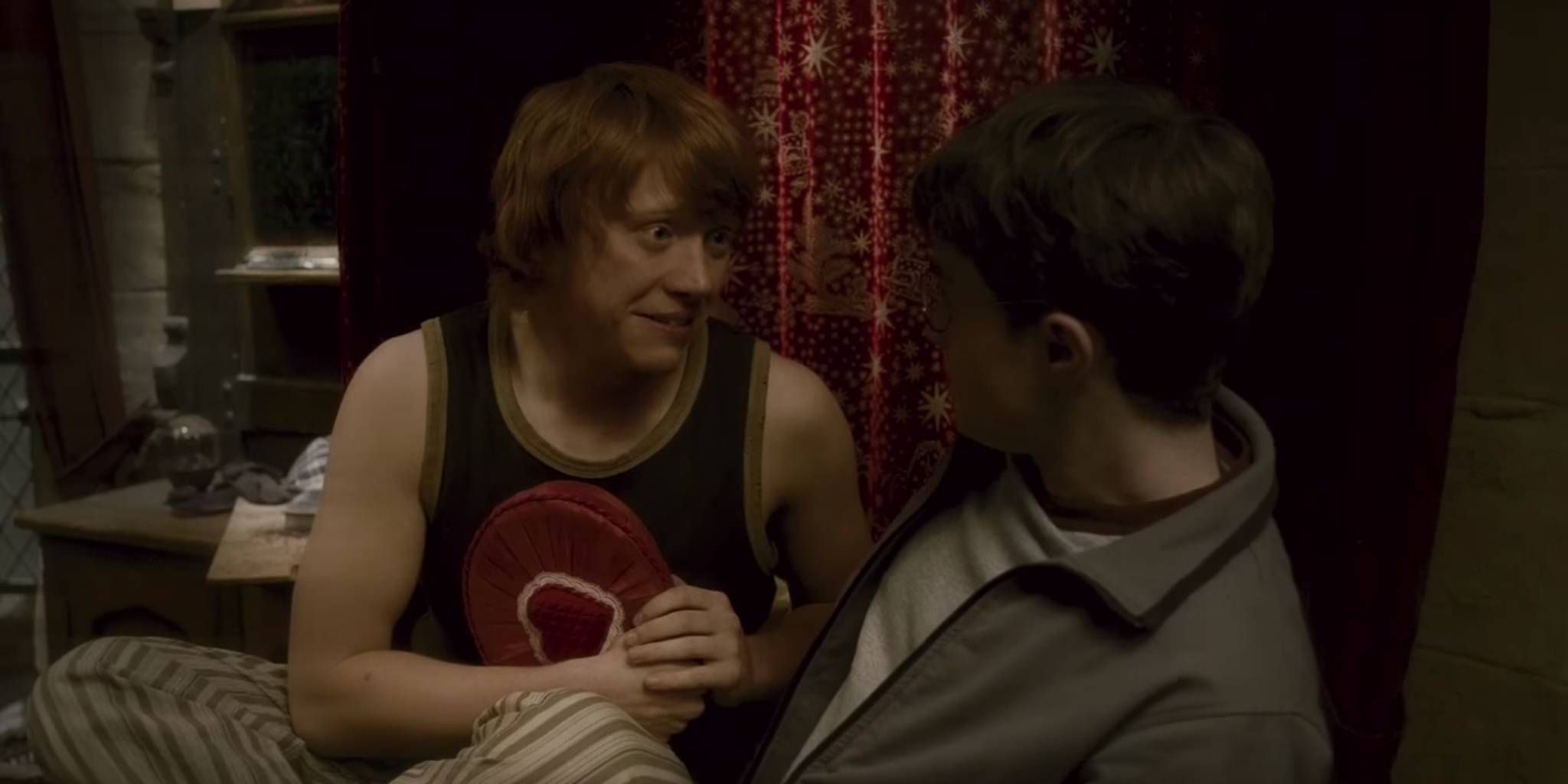 Harry and Ron on a bed talking about Cho Chang.