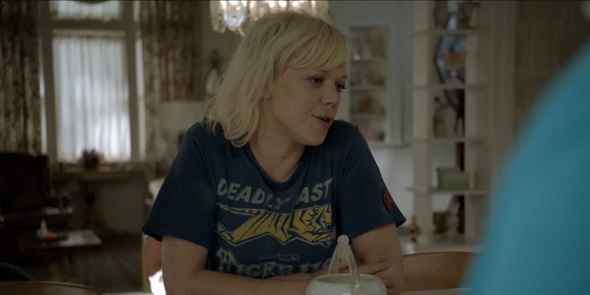 Sammi Slott at the table with a tea cup in Shameless U.S.