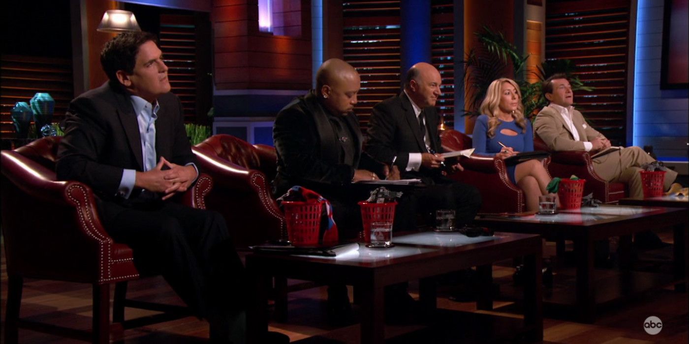 The investors of Shark Tank sitting in chairs.