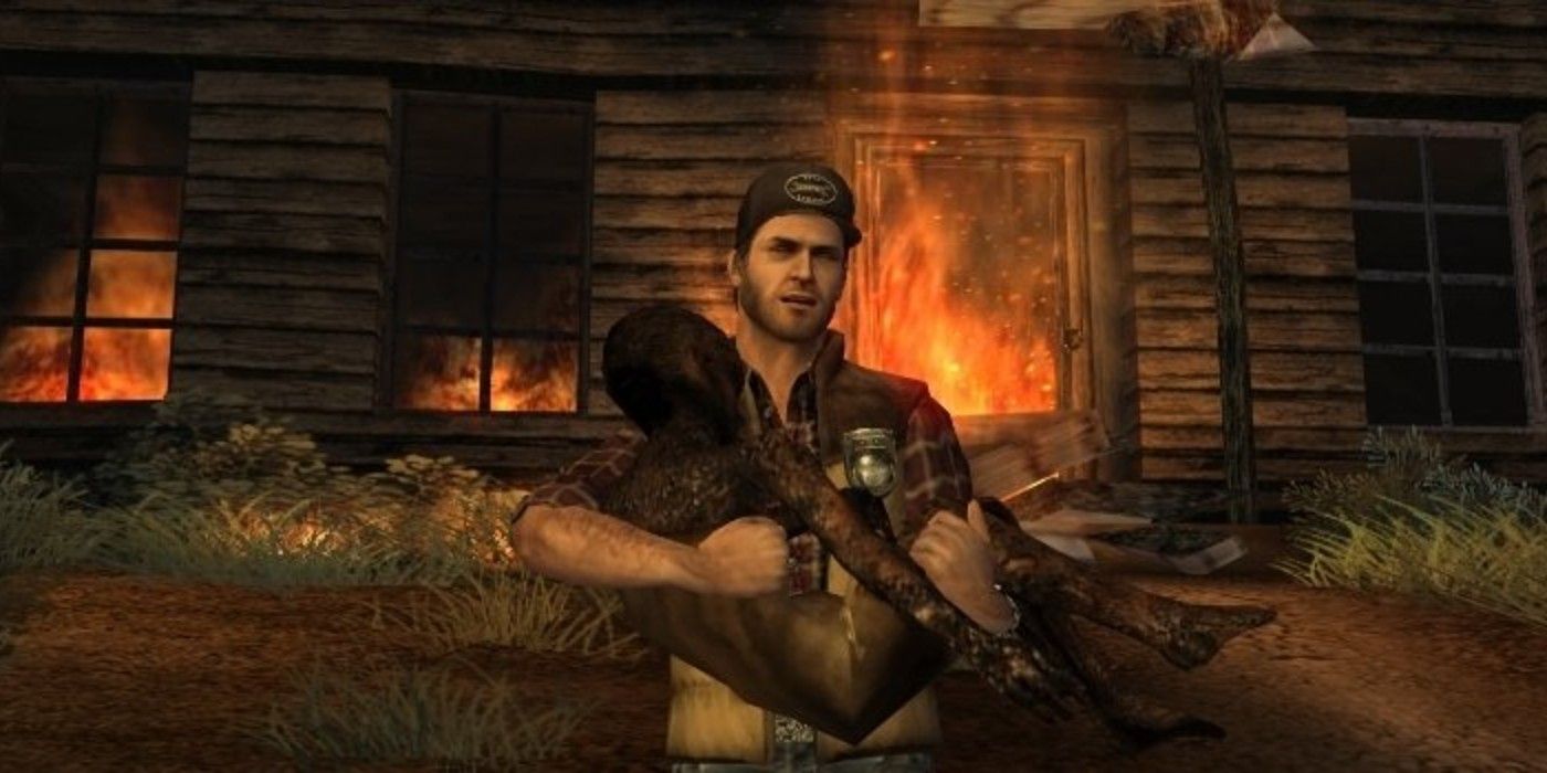 A man carries a dead body from a burning house in Silent Hill Origins 