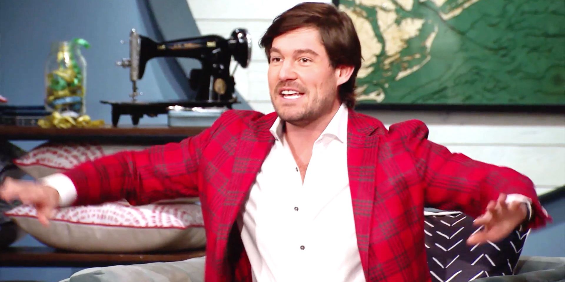 Craig smiling and wearing a red jacket on Southern Charm