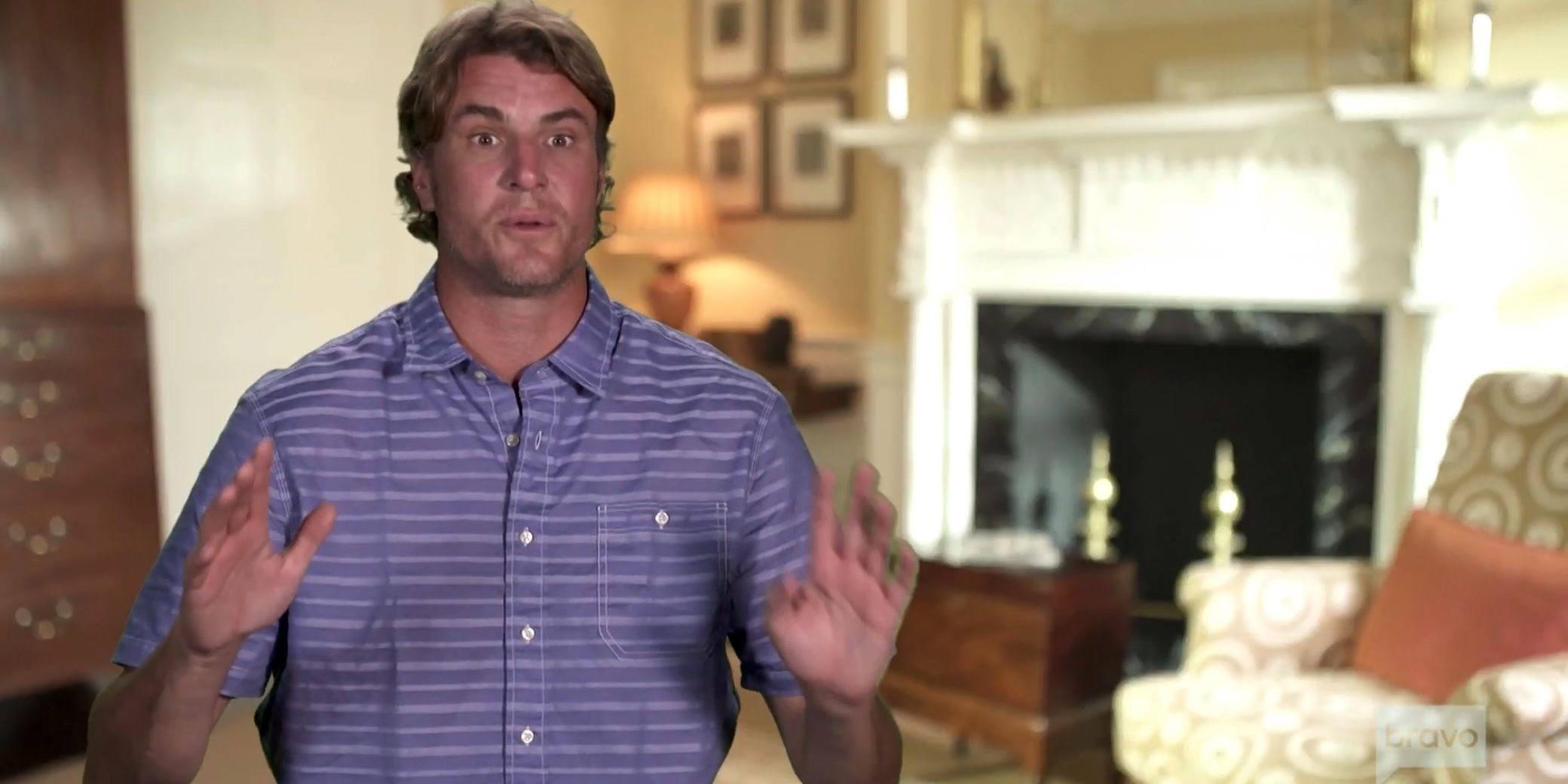 Southern Charm star Shep Rose talking in front of a fireplace