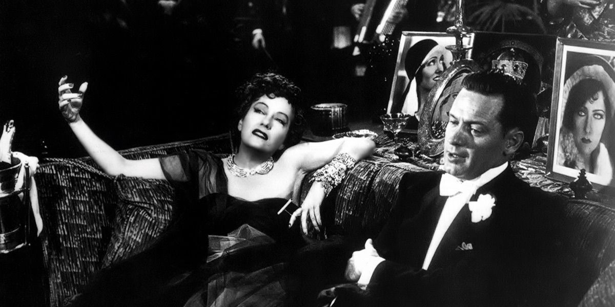Norma lounging in a dress in Sunset Boulevard