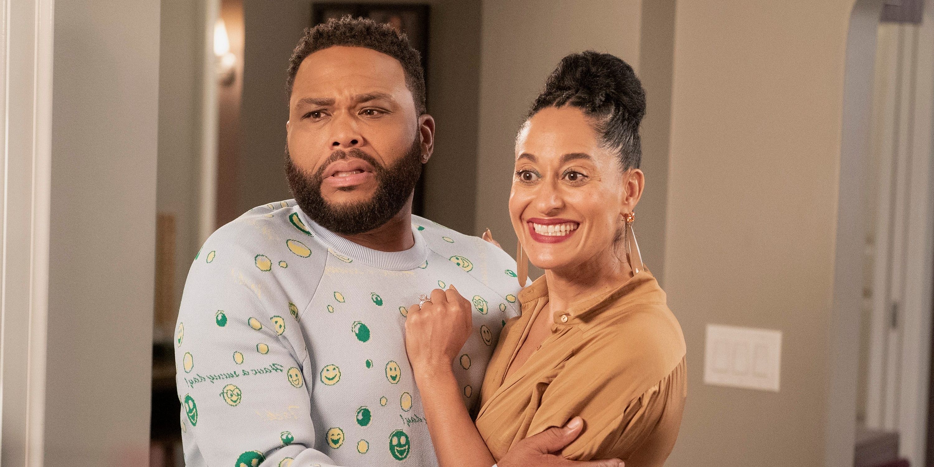 Dre (Anthony Anderson) and Rainbow Johnson (Tracee Ellis Ross) smiling and embracing in &quot;Black-ish.&quot;