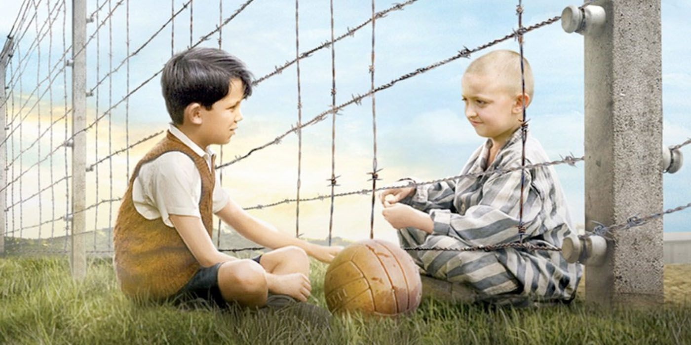 Two boys talk over a fence in The Boy in the Striped Pajamas.