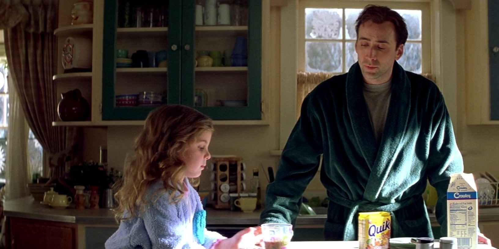 Nicolas Cage looks at his daughter in The Family Man