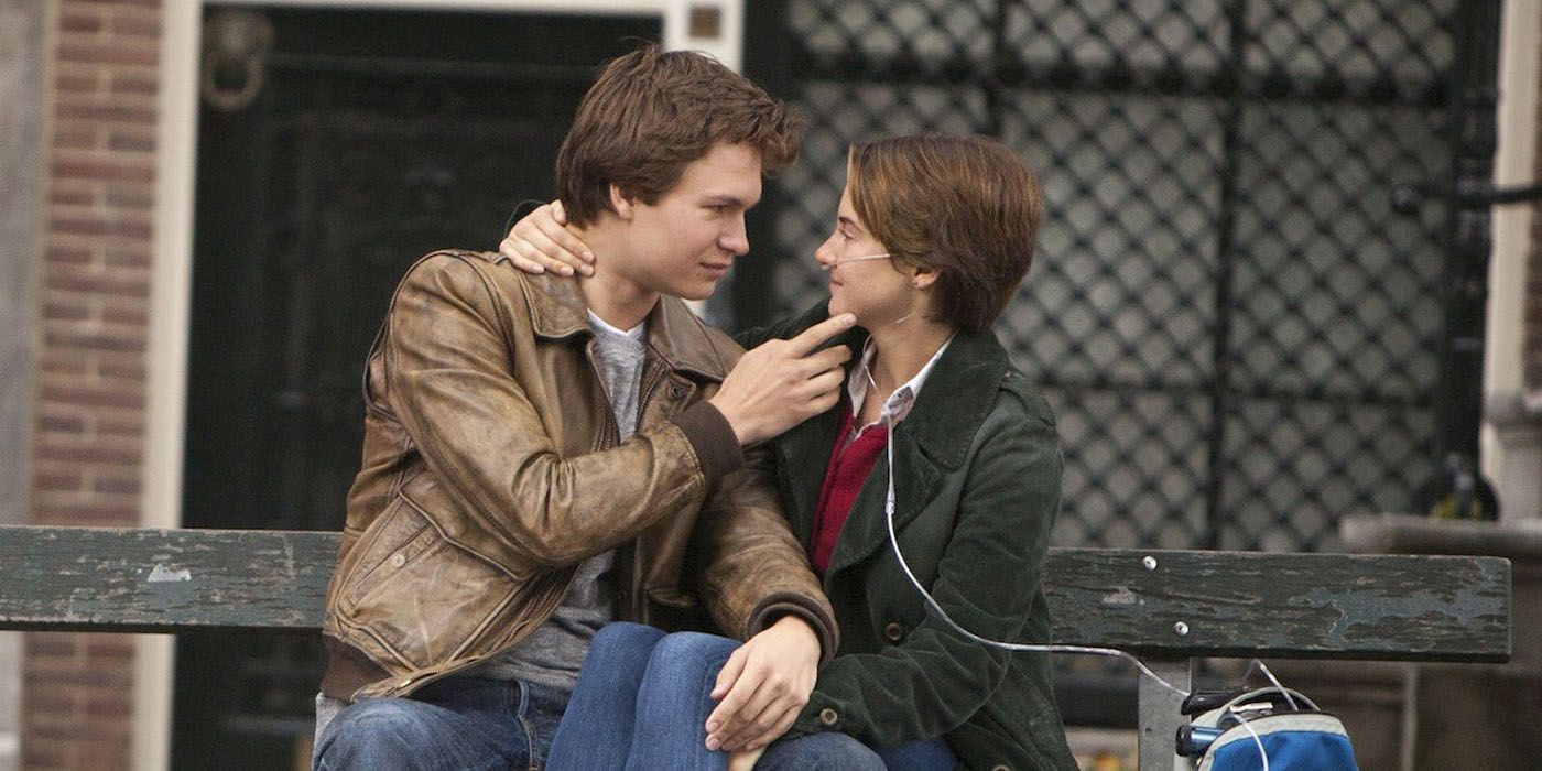 Ansel Elgort and Shailene Woodley embracing on a bench in The Fault in Our Stars