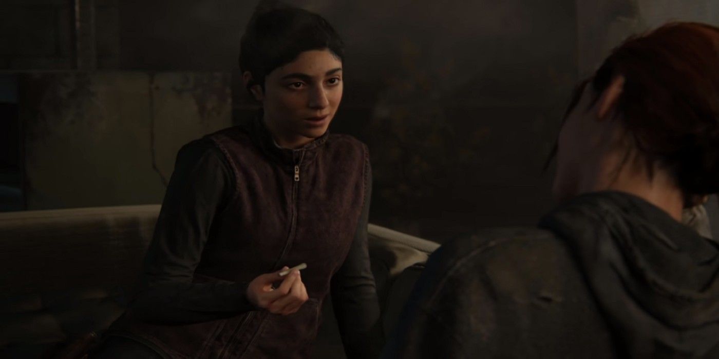 Dina holding a joint in front of Ellie in The Last of Us Part II.